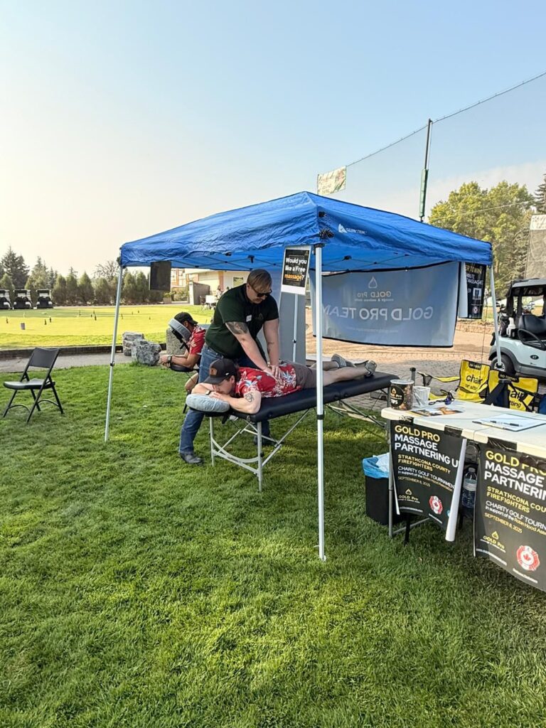 RMT Mason massaging golfer at event